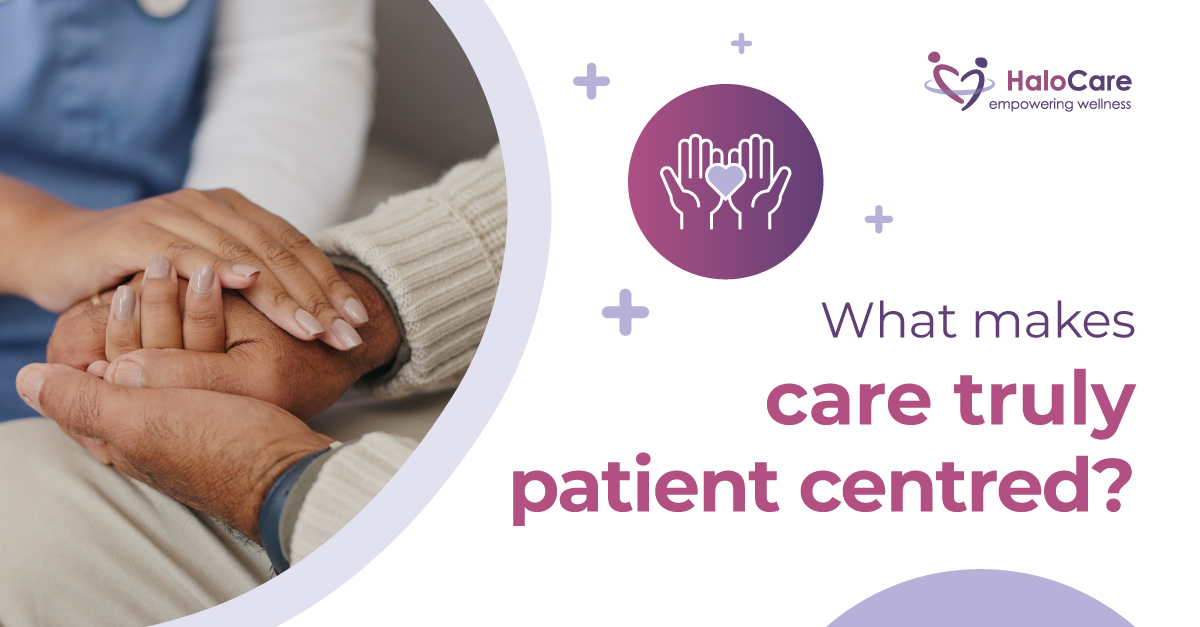 carer holding hands with elderly man