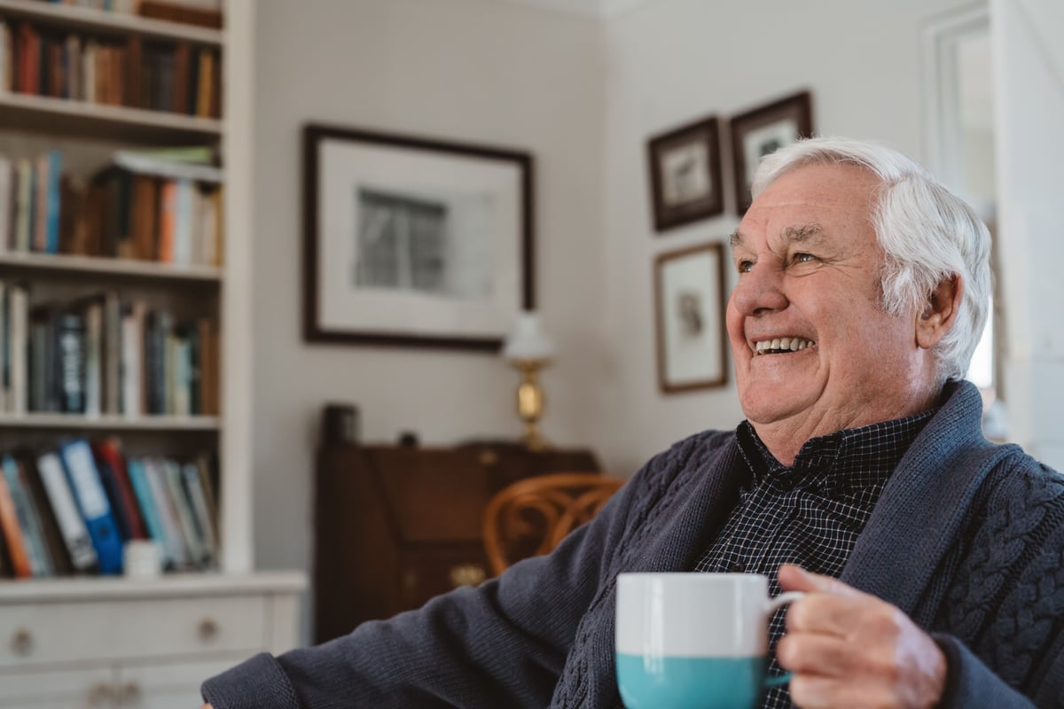 Senior man sitting with a cup of tea