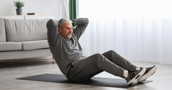 older man working out at home