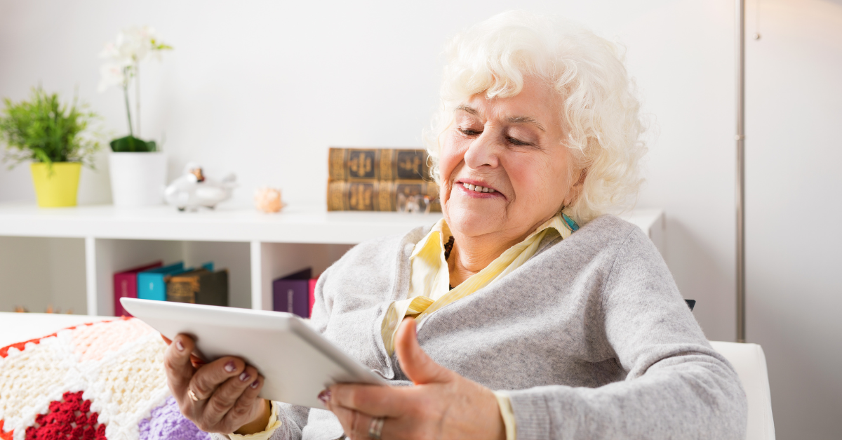 older person using ipad